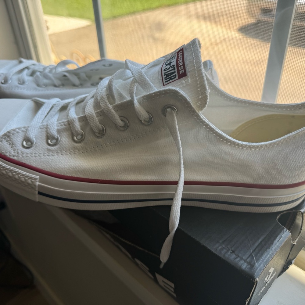 Brand new, never been worn Converse Chuck Taylor shoes.